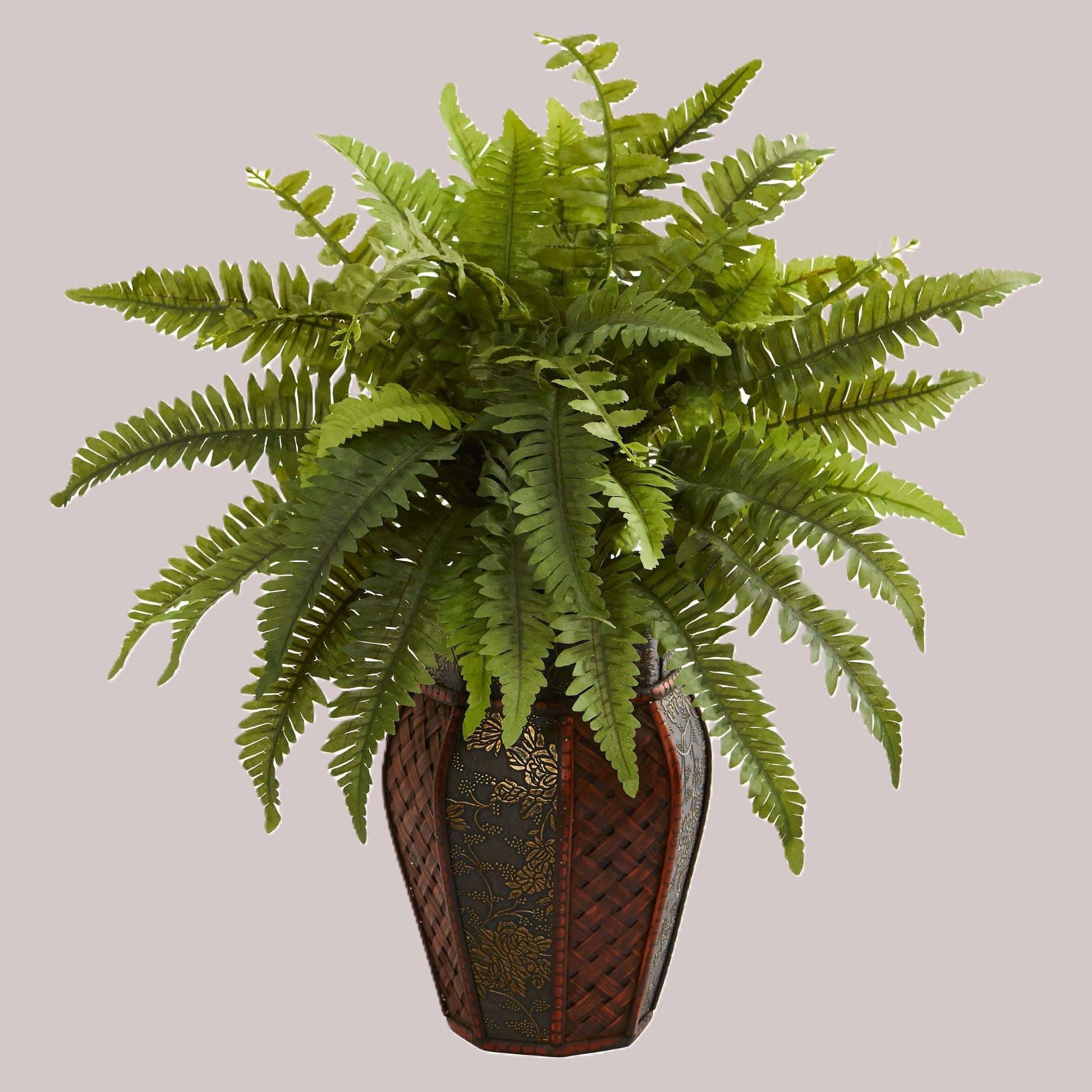 Artificial Boston fern in a decorative planter