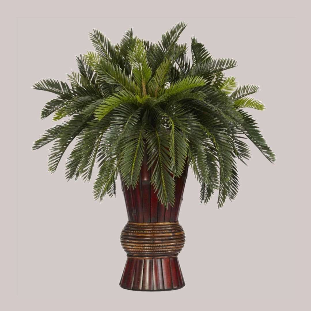 Artificial cycas plant in a decorative bamboo vase combined height of 29 inches