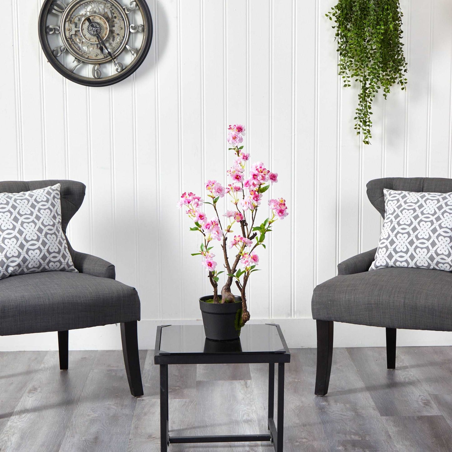 Cherry Blossom Artificial Plant in black planter sitting on black end table