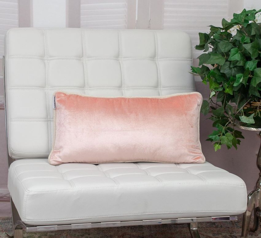 pink & ivory reversible lumbar velvet throw pillow on chair