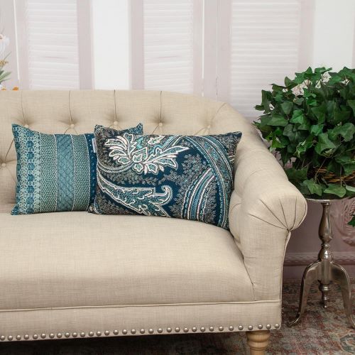 blue beaded and embroidered lumbar pillows set in a traditional living room 