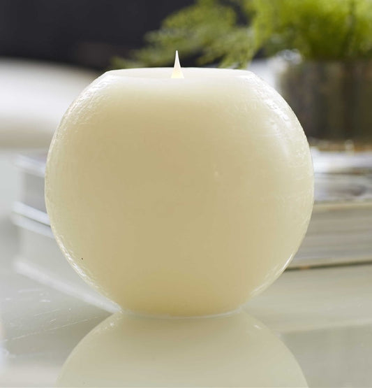 beige round LED flameless candle  6" on tabletop