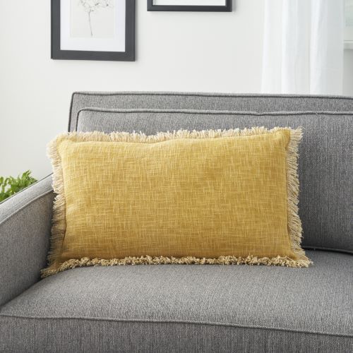 linen cotton blend yellow lumbar pillow with fringe set on couch