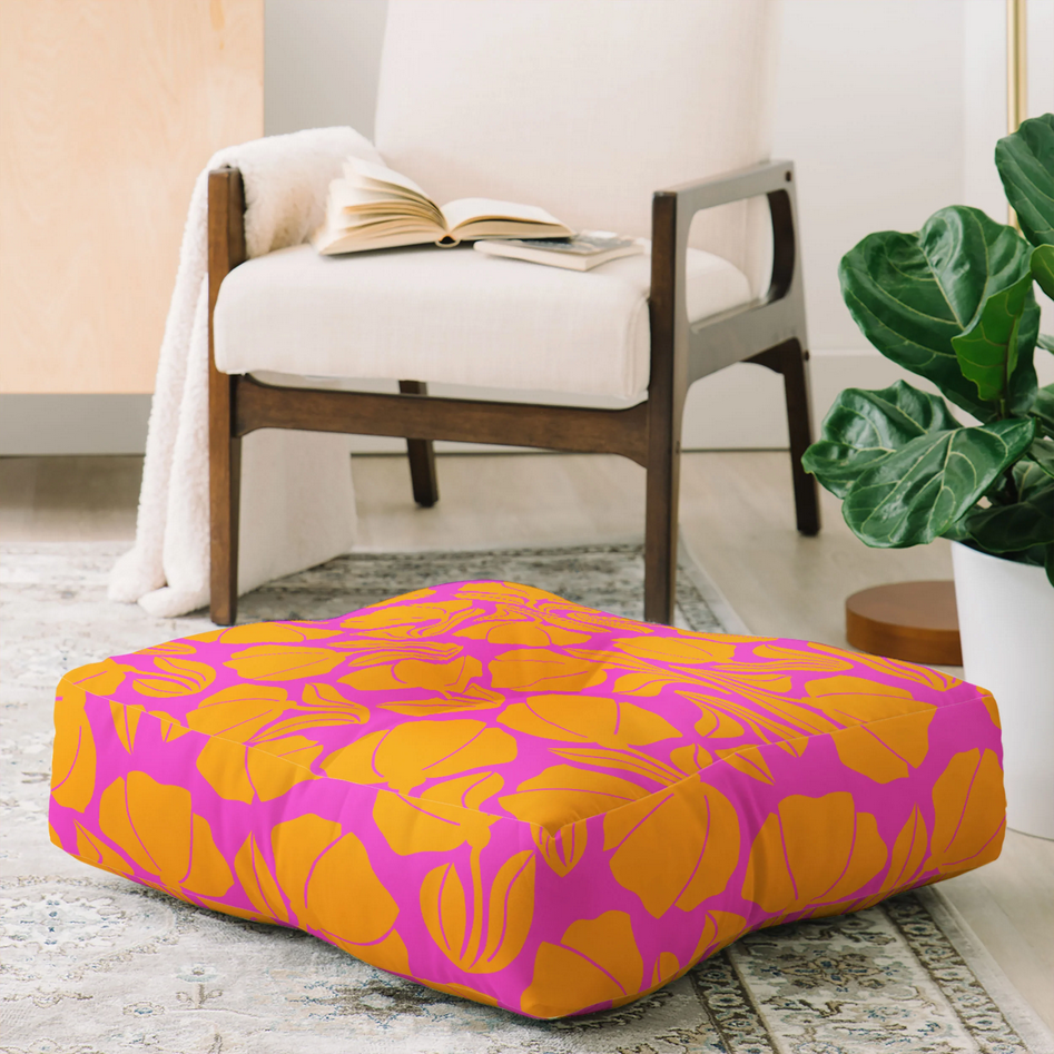 Square floor pillow with yellow blooms on fuchsia base color