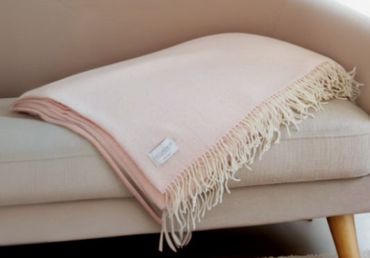 Pink Wool Woven Throw Blanket Folded on Sofa