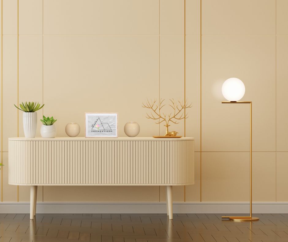 6 inch beige round L.E.D. candles set on a beige credenza set in a modern entryway 